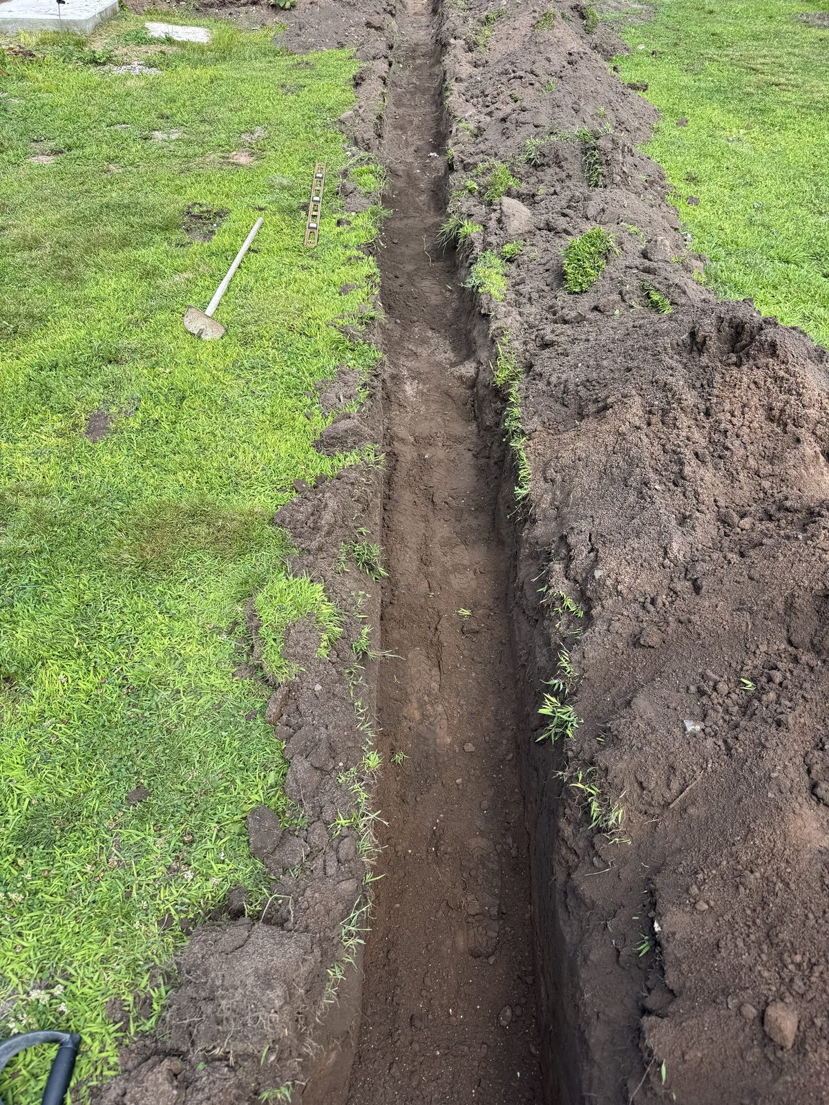 Drainage line dug through a lawn