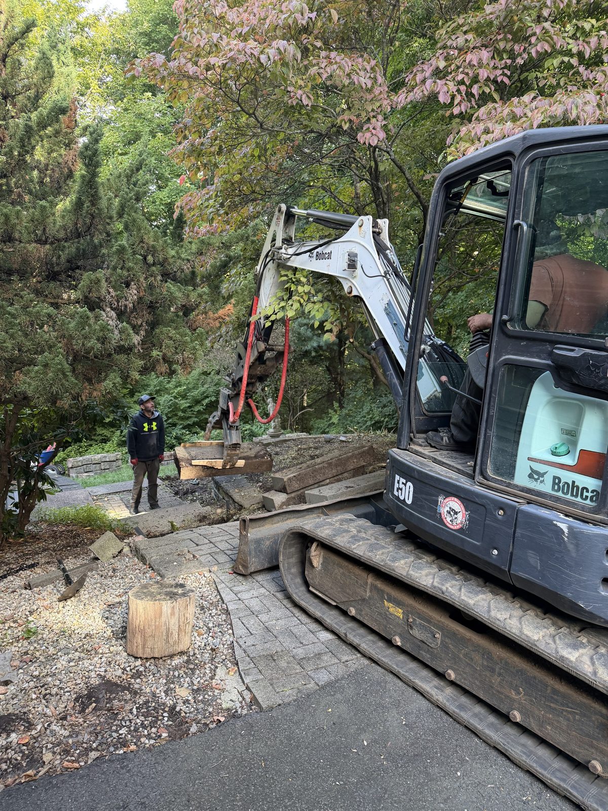 Bobcat excavator working on a landscape project
